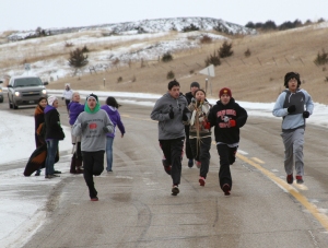 Runners lead the Dakota 38 Memorial riders for the first 10 miles.